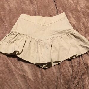A linen skort with a side zipper.